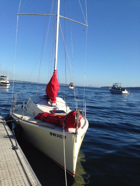 Didi Cruise Mini, docked in water on a blue sky day, starboard side bow view
