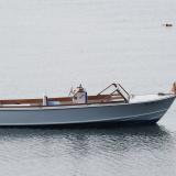 One of a Kind Runabout , in water starboard side view