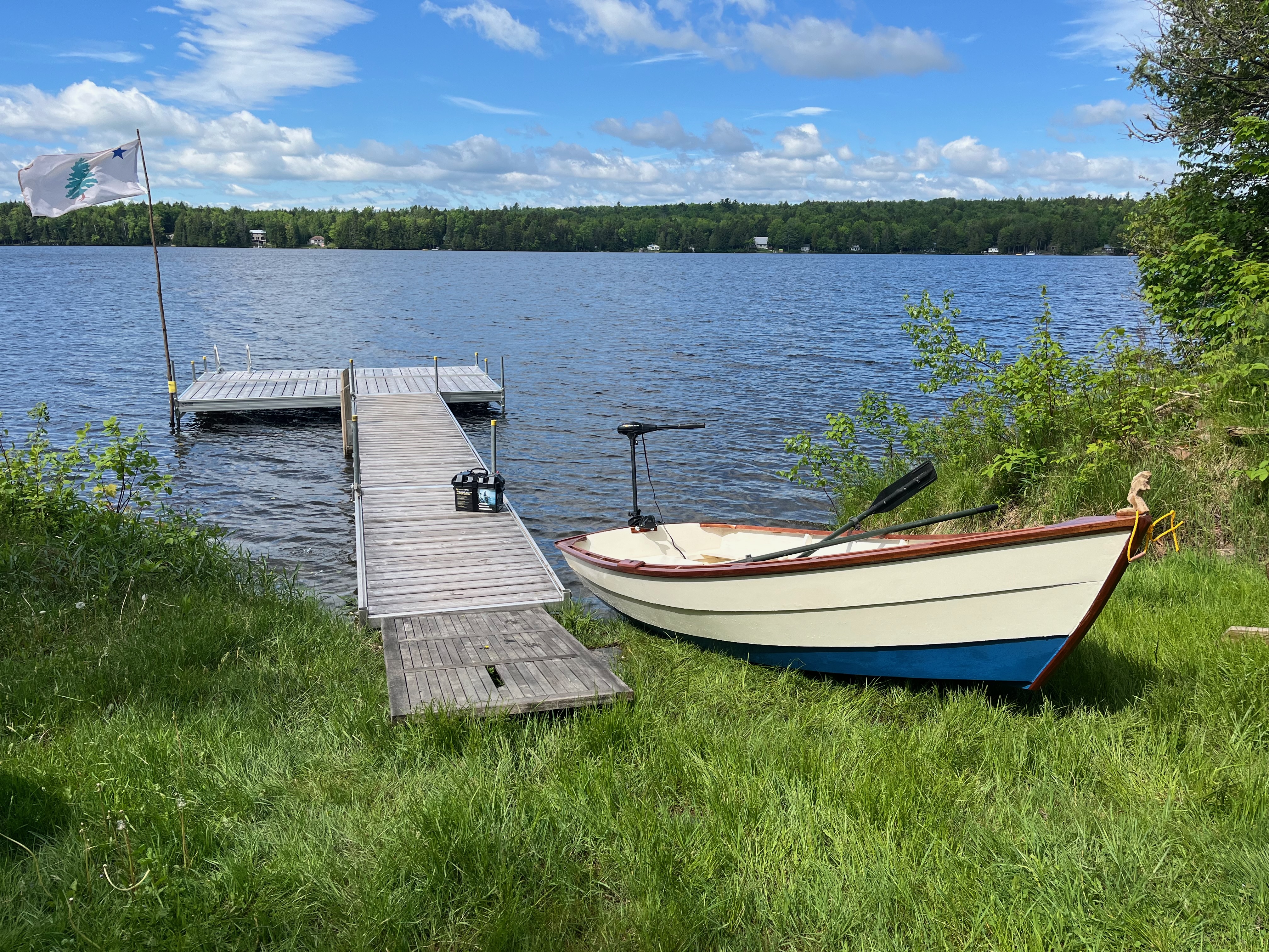 Semi-dory launched on a pond