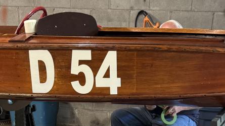 1950 Papst wooden racing boat, full starboard side view, indoors