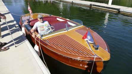 1953 Chris Craft speed boat, docked starboard bow view