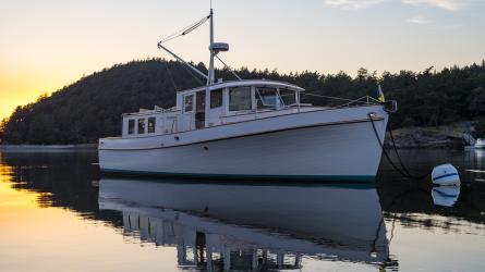 Stunning Pilot House Trawler, in water bow view starboard side