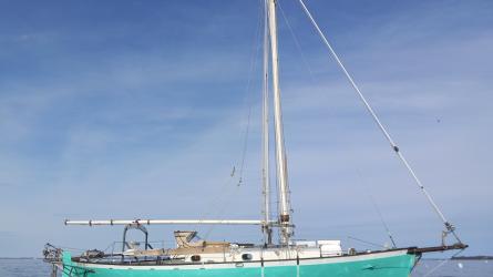 Atkin 30' Gaff-Cutter WindRose 1979, in water starboard side view