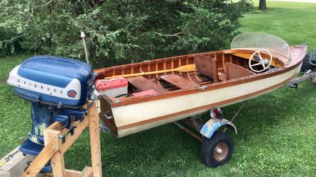 Homemade 14 foot wooden/fiberglass boat, 35 horse power motor.