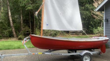 Catspaw Dinghy strip Plank Versian, on trailer sail up, port side view