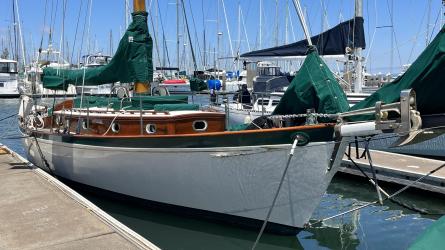 Freelance 38' wooden cutter, docked starboard side view