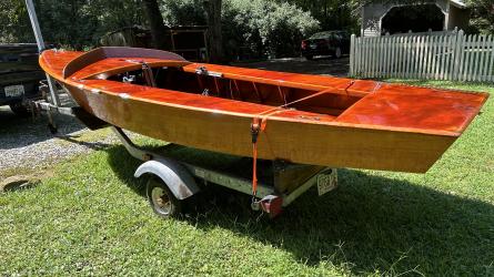 GERBER ALL-VARNISHED WOODEN SNIPE SAILBOAT, on trailer port side view