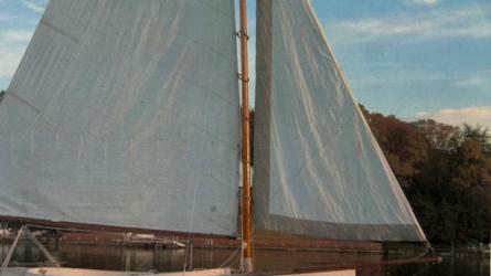 1978 Mystic Cat 15, in water sails up, starboards side view