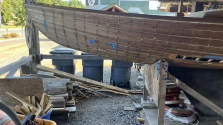 Wooden ballast keel sloop "RASCAL", port side bow end in garage
