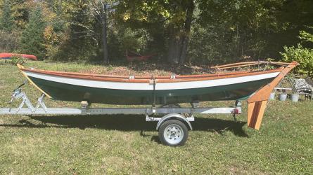 Ian Oughtred 16’ Amber Jack  Dory, on trailer on the grass