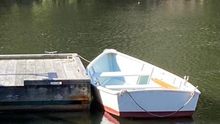 12' wood skiff, docked port side stern end view