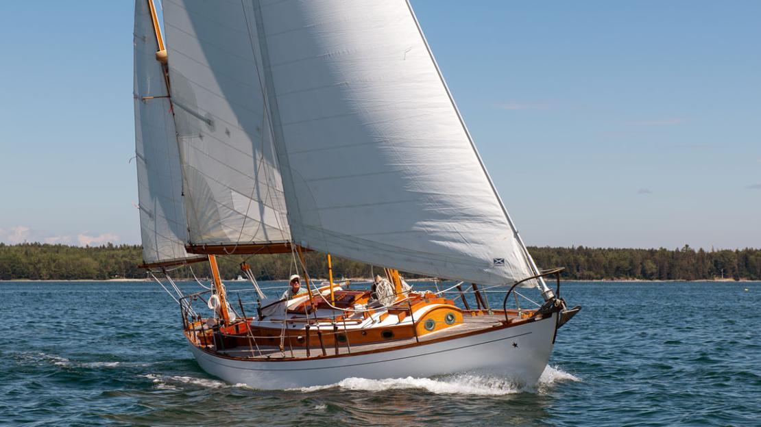 John Williams Boat Co. - WEATHER GAUGE, shown here cruising off the coast  of Labrador, is a A Farr-designed 44 and custom built by Concordia for the  present family in 1984. She