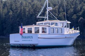 Stunning Pilot House Trawler, in water stern view starboard side