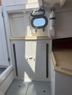 30' Ralph Stanley Classic Lobster Cruiser, view inside cabinets, fire extinguisher 