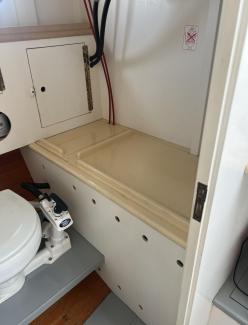 30' Ralph Stanley Classic Lobster Cruiser, view behind head, cabinets, storage