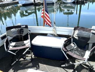 1972 Custom Sedan Cruiser, seats and a cooler in the stern, american flag