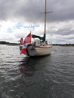 Beautiful 28' sloop, in water starboard stern view