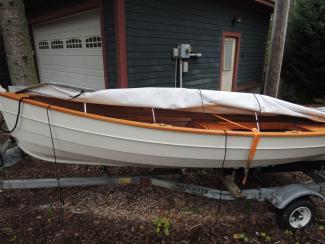 Penobscot 13 wooden sailboat boat for sale. on trailer port side view