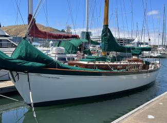 Freelance 38' wooden cutter, docked port side view