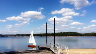 GERBER ALL-VARNISHED WOODEN SNIPE SAILBOAT, view in water undersail