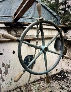  JOHN ALDEN DESIGNED CATBOAT , view of helm/wheel