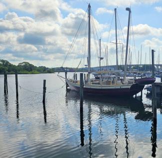 2002 Reuel Parker 50' Ketch "Tien Hou", docked, port side stern view, dinghy