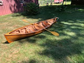 "Piccolo" 12' 8" Sailing Canoe and Model on the grass, oar