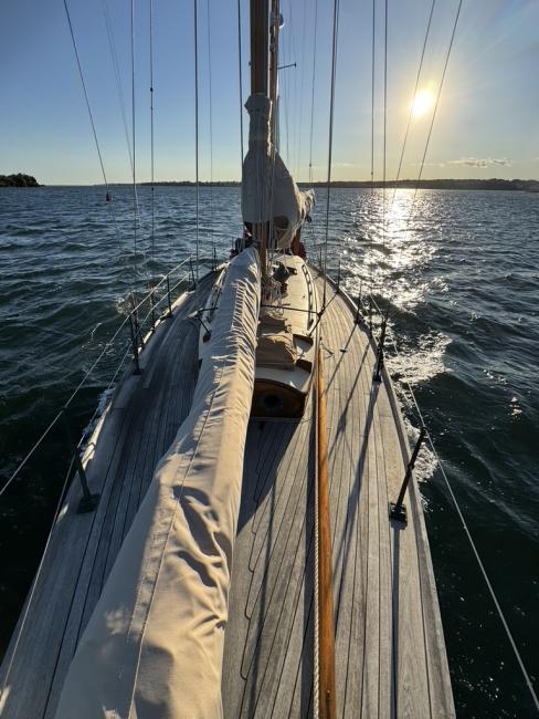 Concordia 39 LLC Partnership, photo in water looking toward bow sun on the horizon