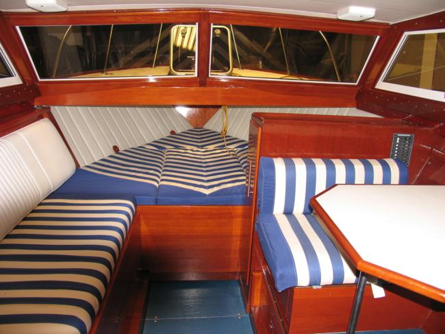 1963 Chris-Craft Futura 33', view inside seating area, berth, table