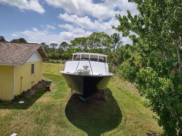 40' Lobster  Boat Custom Trawler, on stands on grass, bow view