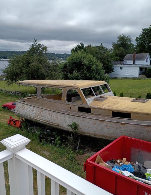 38' foot Matthews deluxe stock cruiser, on the lawn, on stands, starboard side view