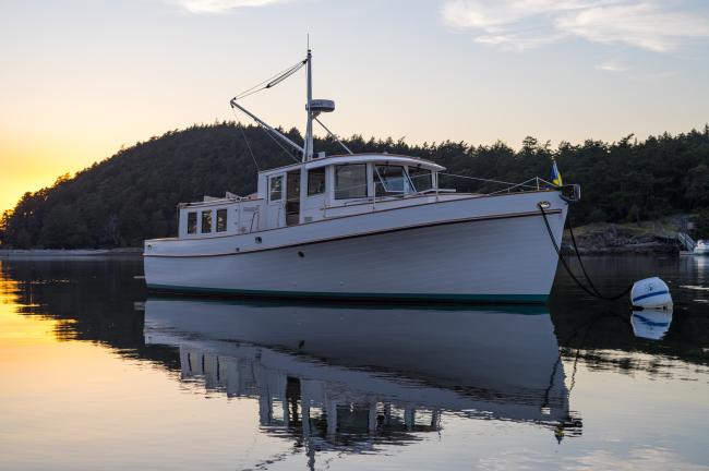 Stunning Pilot House Trawler, in water bow view starboard side