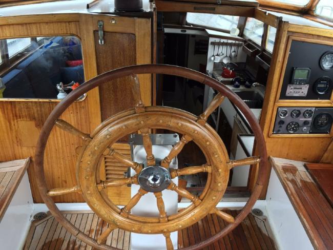 51ft 1956 Vic Franck Built Custom Ben Seaborn Sloop - Sea Fever, the helm