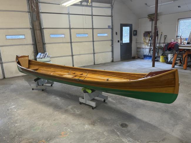 New Adirondack Guide Boat for Sale, on stands, inside