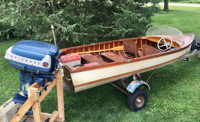 Homemade 14 foot wooden/fiberglass boat, 35 horse power motor.