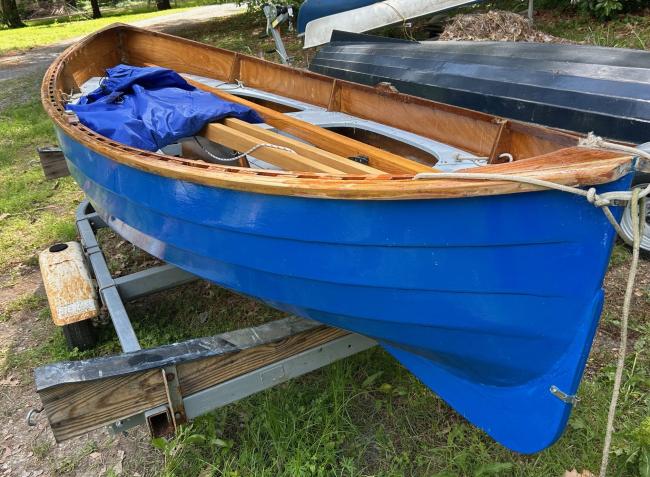 Chesapeake Light Craft Peapod, on trailer, side of boat