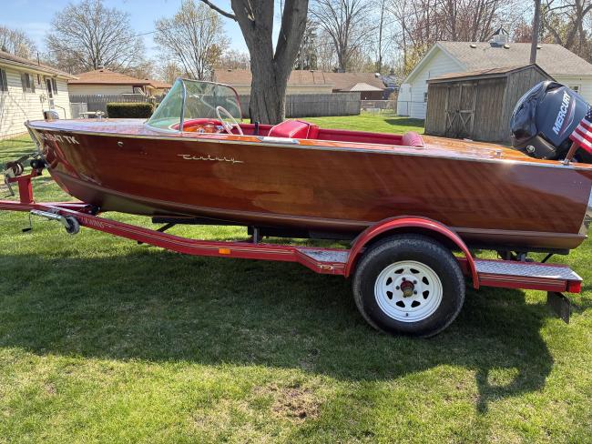 Classic 1956 Century Palomino Runabout 15', on trailer port side view