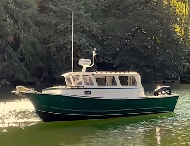 Tolman Jumbo 24, in water port side view