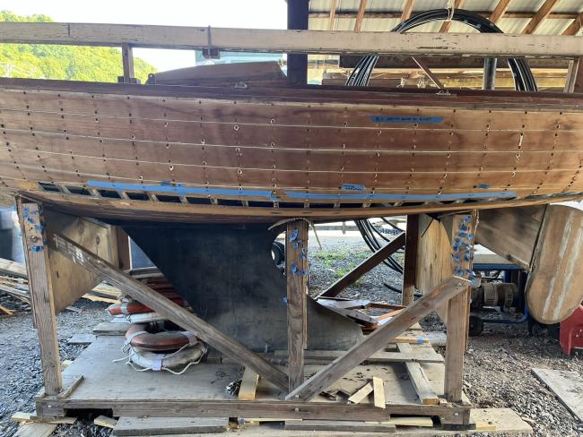 Wooden ballast keel sloop "RASCAL", port side view in garage