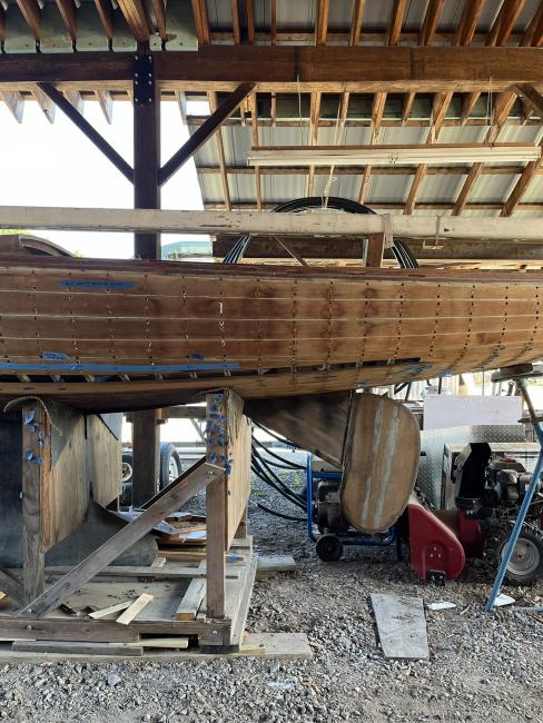 Wooden ballast keel sloop "RASCAL", on stands inside port side view