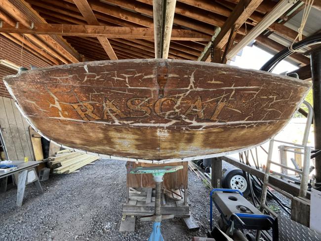 Wooden ballast keel sloop "RASCAL", on stands inside view of transom