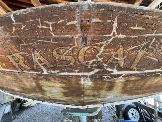 Wooden ballast keel sloop "RASCAL", on stands inside view of stern