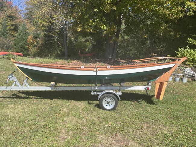 Ian Oughtred 16’ Amber Jack  Dory, on trailer on the grass