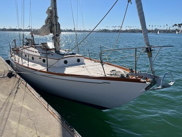 "MERRYWING" A 39' sloop, starboard side bow view, docked