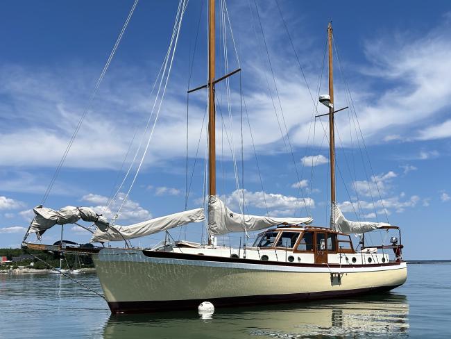 Pilothouse ketch, in water port side view
