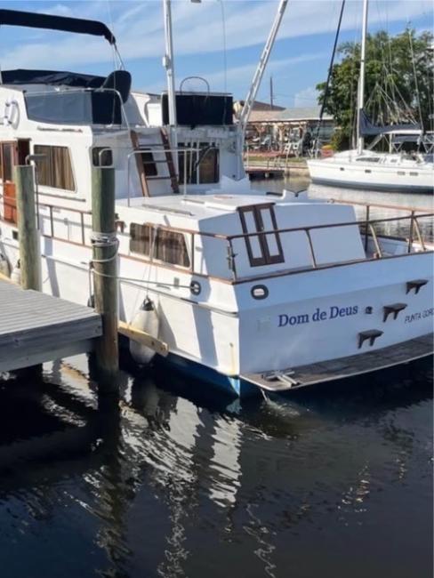 Grand Banks luxury motor yacht, in water stern view