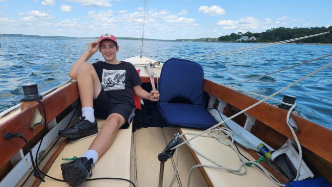 International 210 Hull No. 228 Restoration Complete, view on deck, happy people sailing