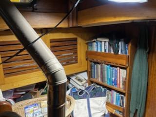 MacIntosh Schooner for sale, inside view shelves stove pipe