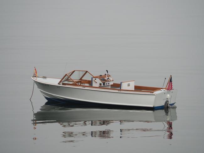 One of a Kind Runabout , in water port side view