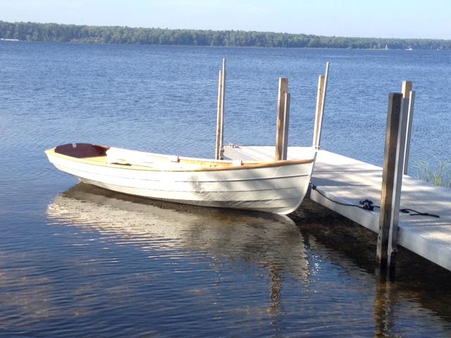 Penobscot 13 wooden sailboat, docked starboard side view